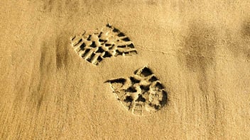 one boot print in sand hero image